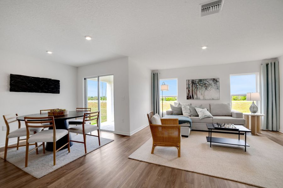 A living room with a large glass door.