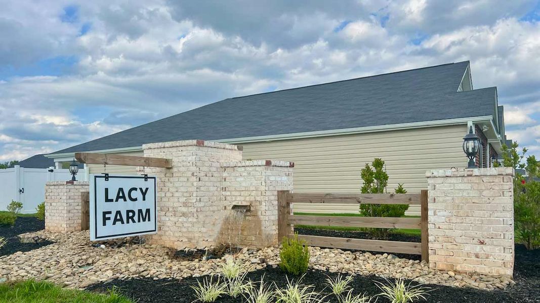 Entrance to the Lacy Farm community in Graham, NC, featuring signage and landscaping (Image 1). Entrance to the Lacy Farm community in Graham, NC, featuring signage and landscaping (Image 1).