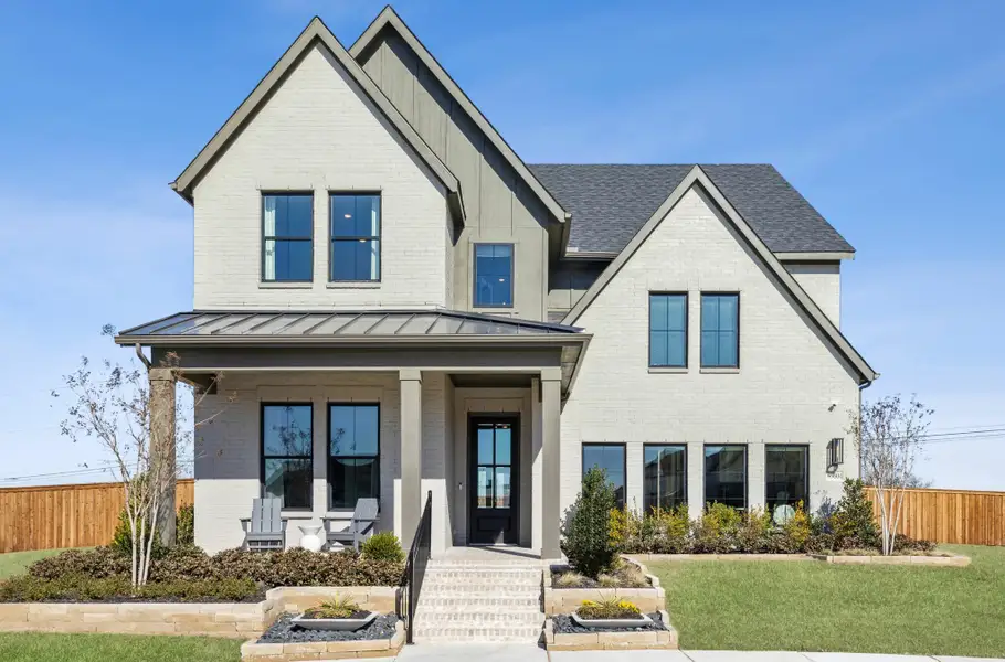 Front exterior of a home in the Village on Main Street community, located in Frisco, TX (Image 5).