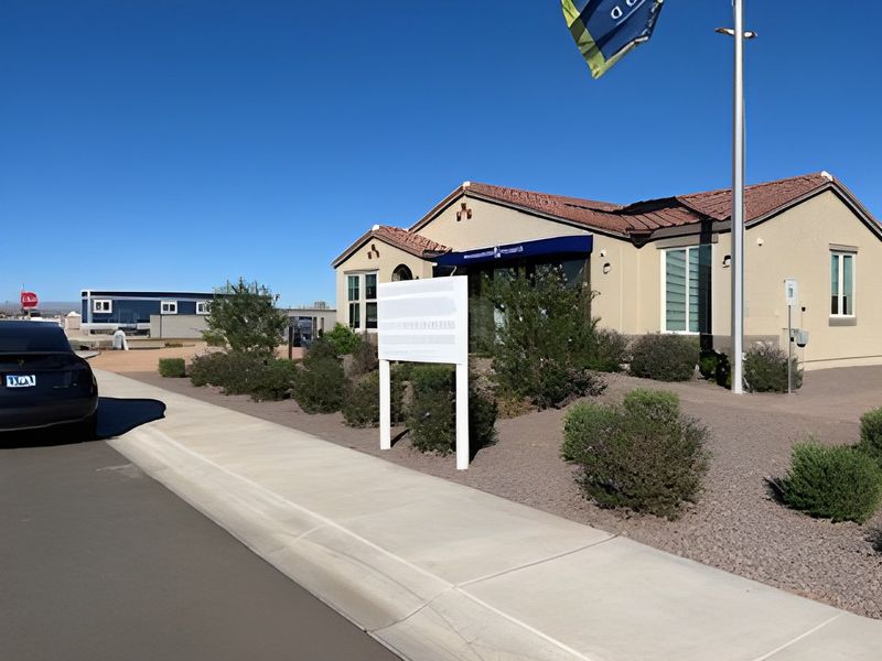 A charming stucco home with a tiled roof and desert landscaping in North Copper Canyon by Oakwood Homes Co (Surprise, AZ).