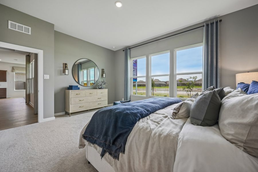 A bedroom with a large bed.