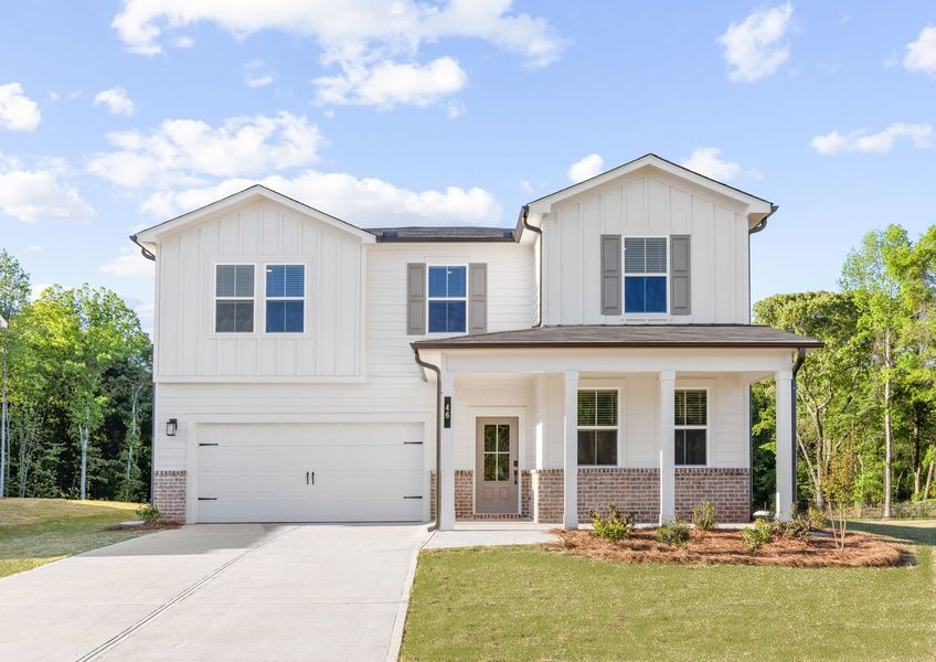 A white house with a driveway.