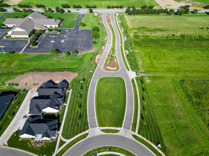 Aerial view of the The Courtyards at The Moorings community in Wichita, KS, showing layout and nearby surroundings (Image 12).