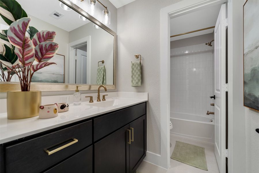 Furnished interior in a model home at Sunterra Lakes in Brookshire (Image 40).