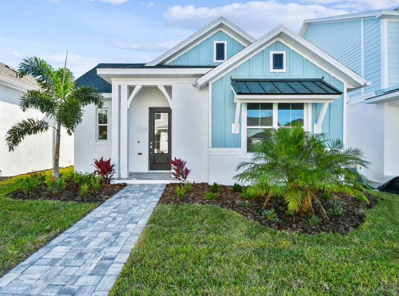 Front exterior of a home in the Emerald Landing at Waterside at Lakewood Ranch – Cottage Series community, located in Sarasota, FL (Image 4).