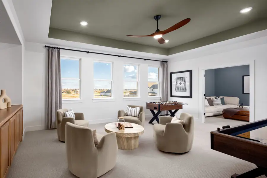 Furnished interior in a model home at 6 Creeks in Kyle (Image 34).