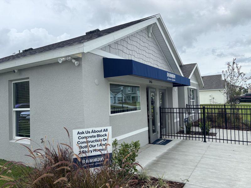 A modern model home with a sleek facade and a welcoming awning in Autumn Glen by D.R. Horton (Belleview, FL).