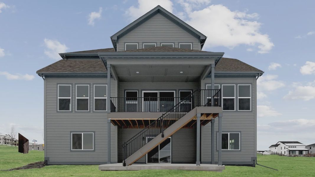 Experience luxury in Montaine with this elegant home featuring a central stairway and spacious open porch.