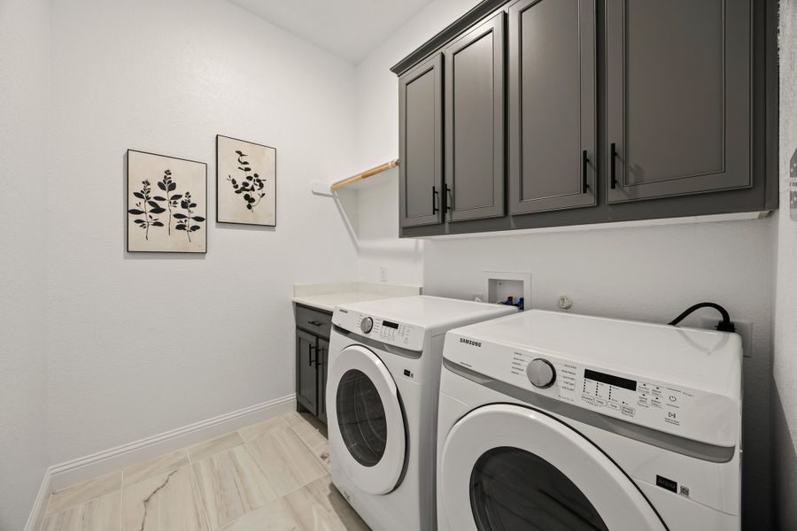 Furnished interior in a model home at Abe's Landing in Granbury (Image 26).