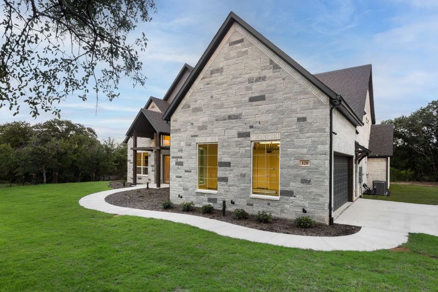 Front exterior of a home in the Lola Creek Ranch community, located in Boyd, TX (Image 12).
