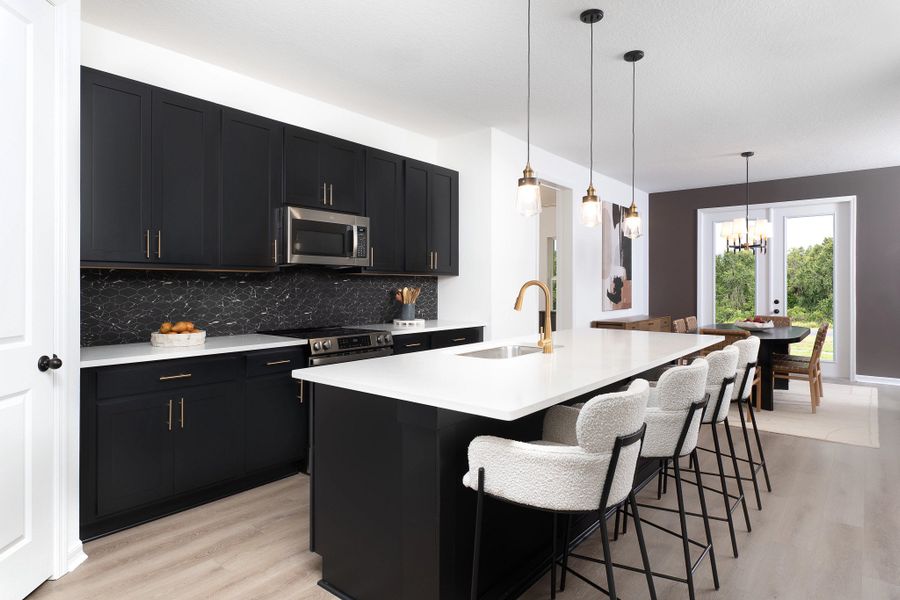 Furnished interior in a model home at Hawks Run in Kissimmee (Image 5).