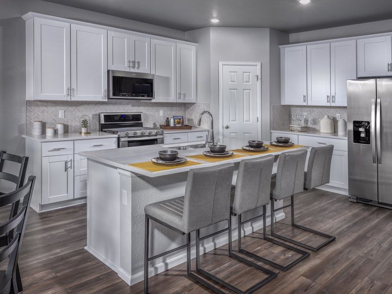 Furnished interior in a model home at Buffalo Highlands: The Canyon Collection in Commerce City (Image 3).