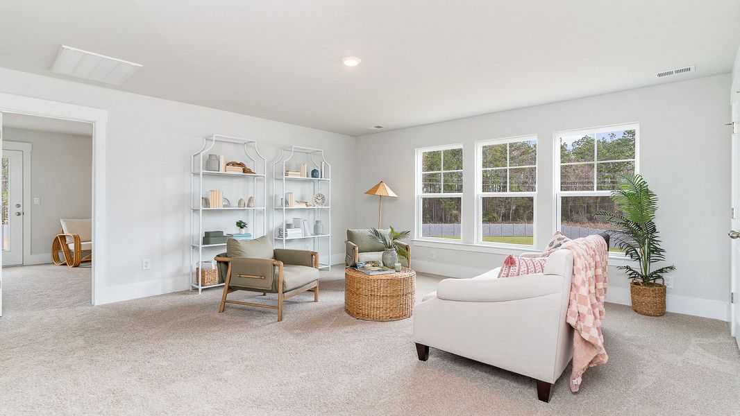 Furnished interior in a model home at Heron Pointe in Myrtle Beach (Image 13).
