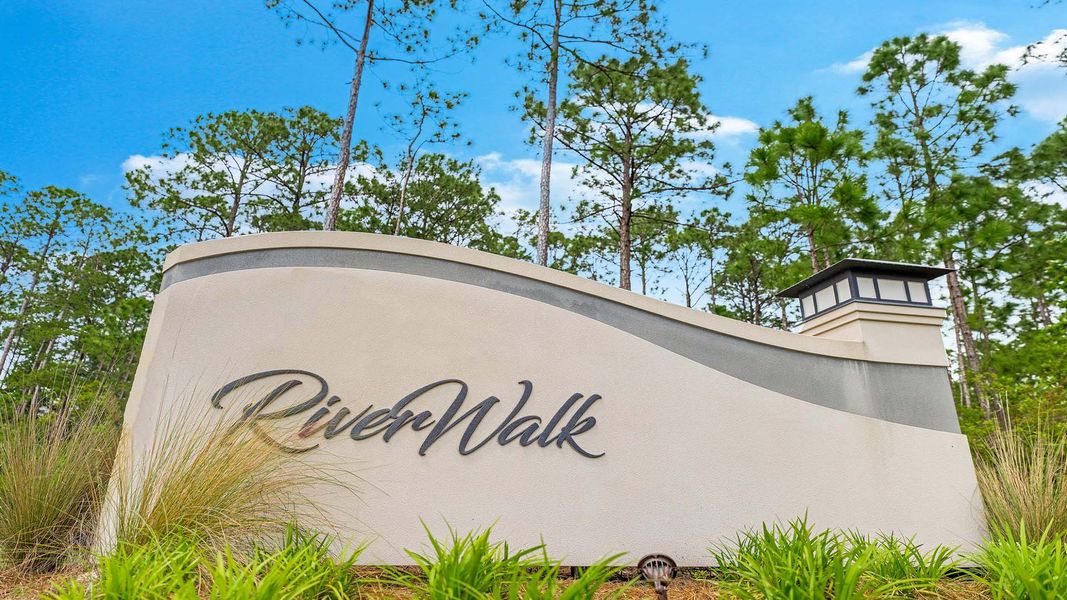 Entrance to the Riverwalk community in Freeport, FL, featuring signage and landscaping (Image 5). Entrance to the Riverwalk community in Freeport, FL, featuring signage and landscaping (Image 5).