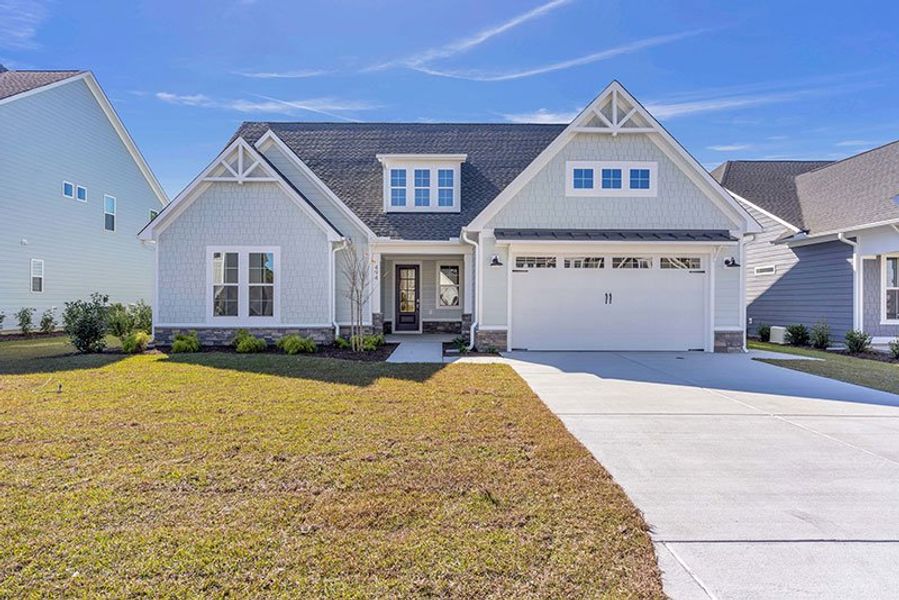 Front exterior of a home in the WyndWater community, located in Hampstead, NC (Image 35).