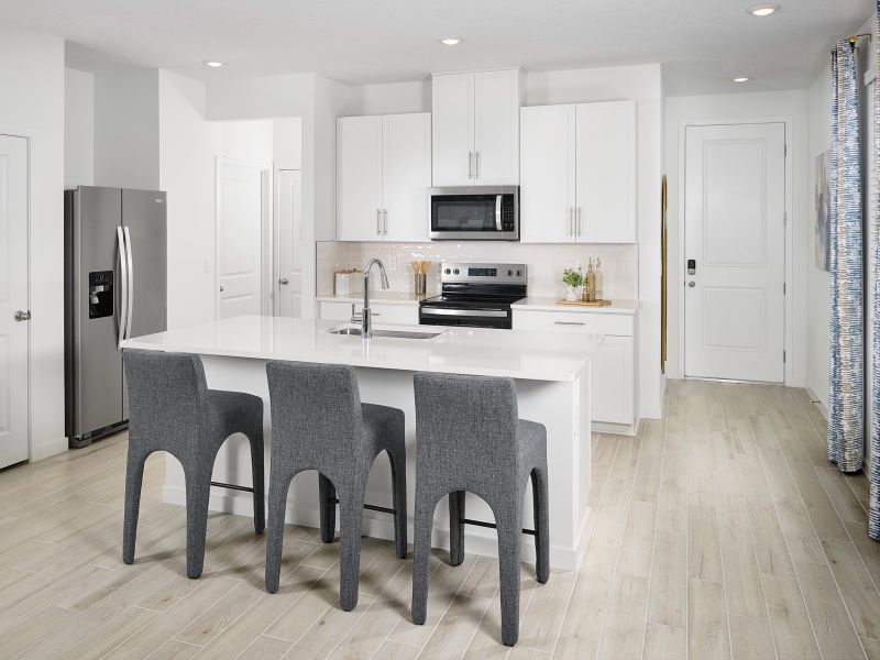 Furnished interior in a model home at The District at Oakleaf - The Grove in Middleburg (Image 3).