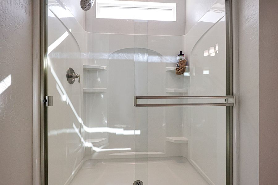 A shower with a glass door. A shower with a glass door.