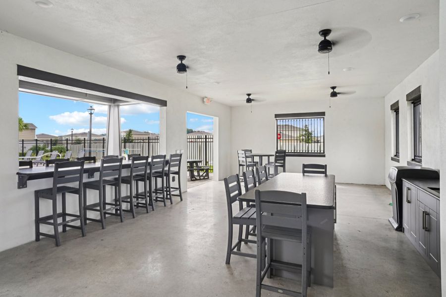 A room with tables and chairs.