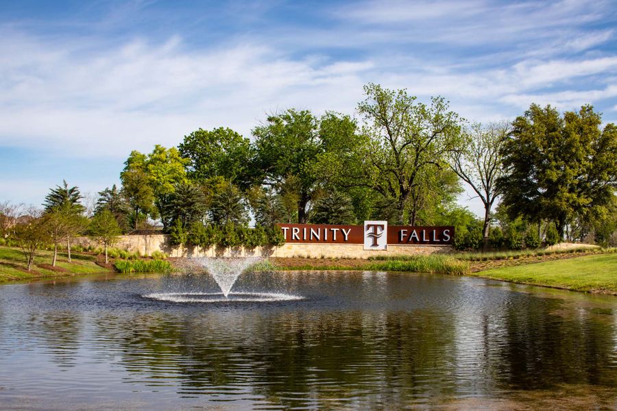 Entrance to the Trinity Falls community in McKinney, TX, featuring signage and landscaping (Image 24).