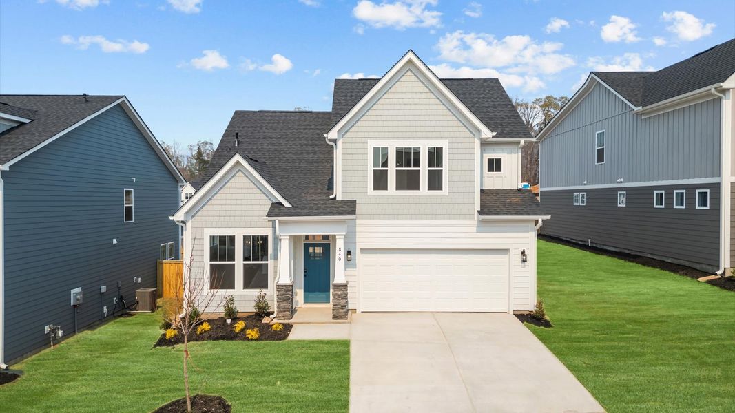 Exclusive DRB Homes exterior with balanced proportions and vibrant curb appeal at the Barton Hollow community