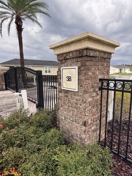 Charming entrance with brick pillars and floral landscaping in Summer Bay at Grand Oaks by Pulte Homes (St. Augustine, FL). Charming entrance with brick pillars and floral landscaping in Summer Bay at Grand Oaks by Pulte Homes (St. Augustine, FL).