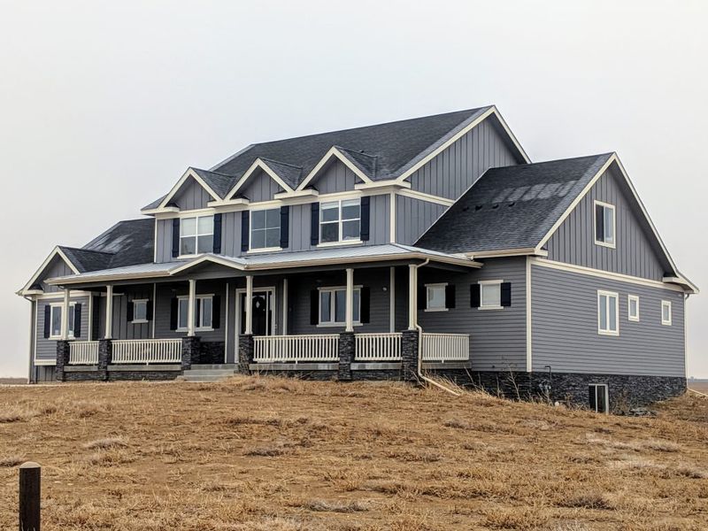 Front exterior of a home in the Red Barn community, located in Platteville, CO (Image 5).
