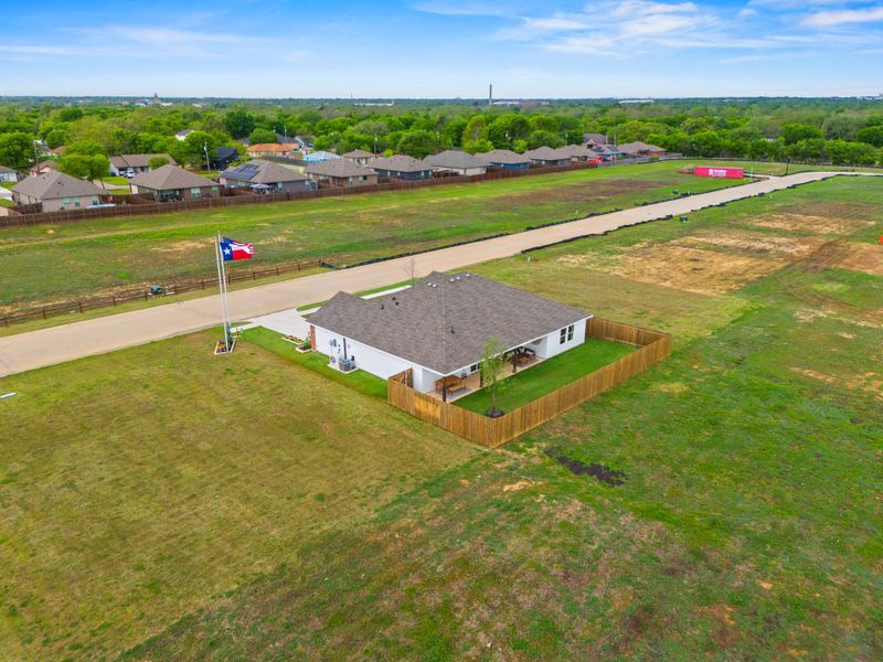 A small building in a field. A small building in a field.