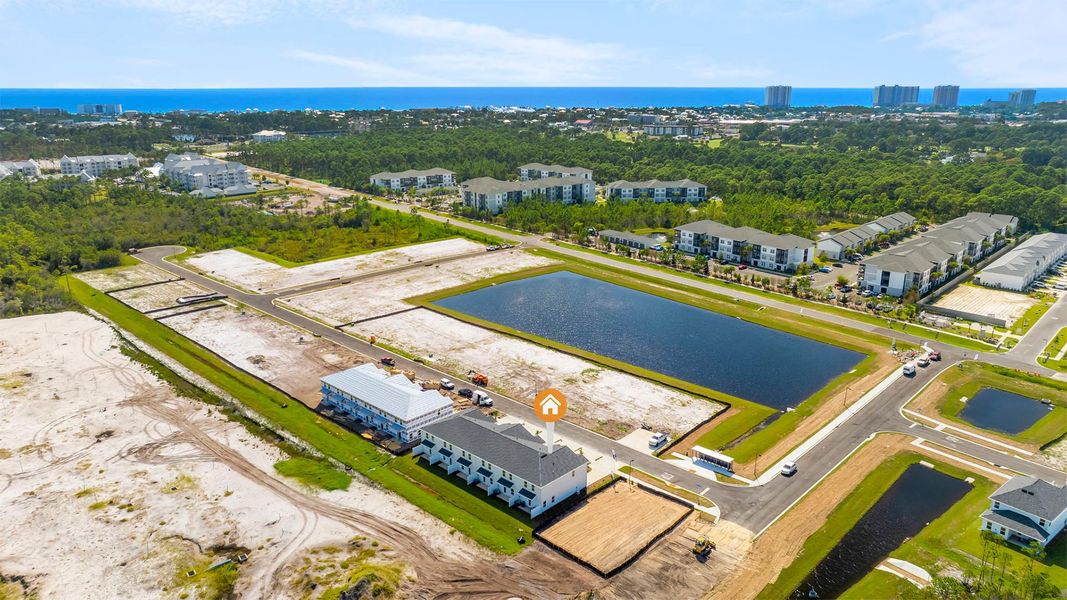 Aerial view of the Colonial East Townhomes community in Panama City Beach, FL, showing layout and nearby surroundings (Image 10).