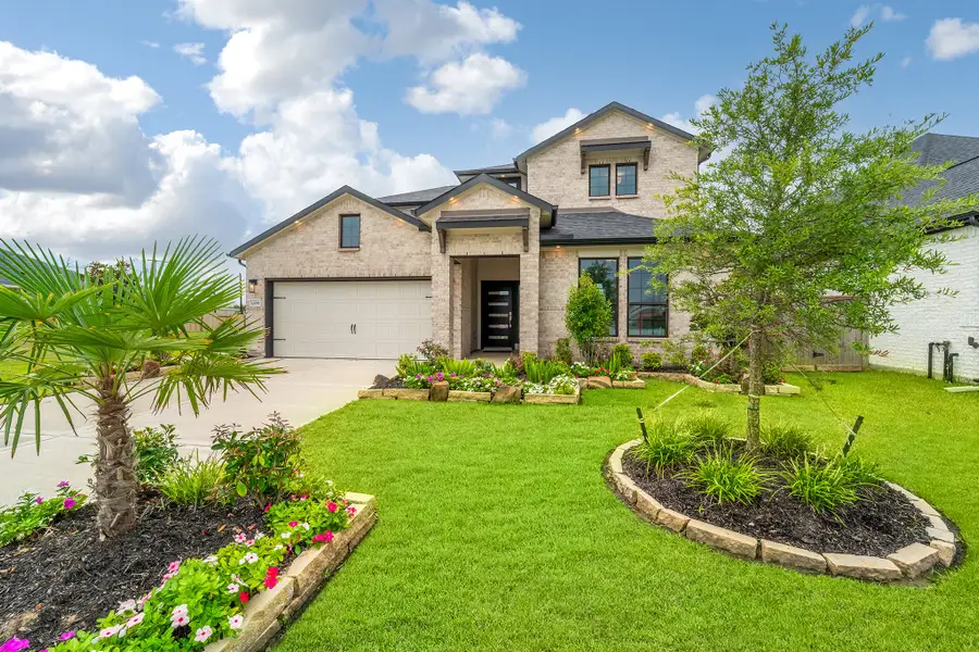 Front exterior of a home in the Mulberry Farms community, located in Santa Fe, TX (Image 10).