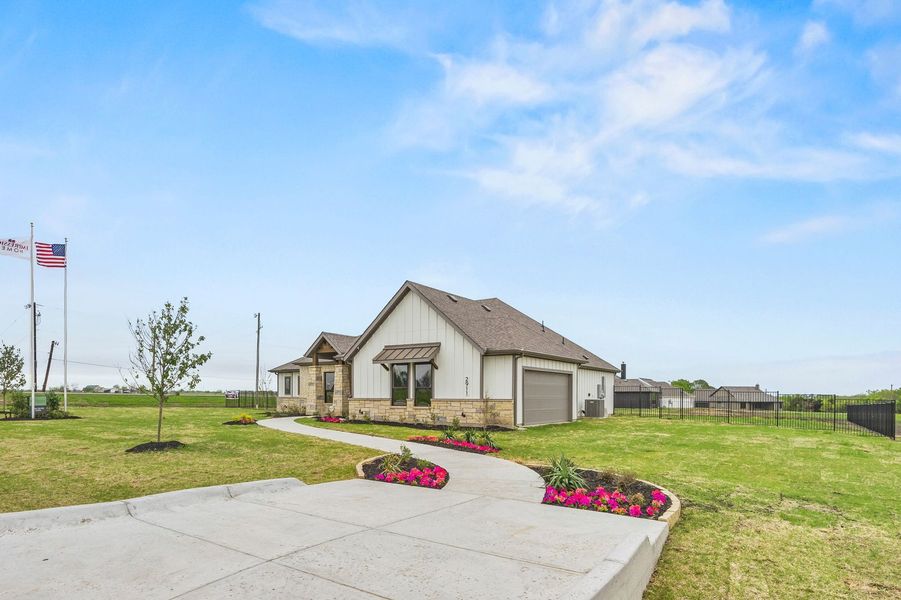 Front exterior of a home in the Carrera Ranch community, located in Waxahachie, TX (Image 3). Front exterior of a home in the Carrera Ranch community, located in Waxahachie, TX (Image 3).