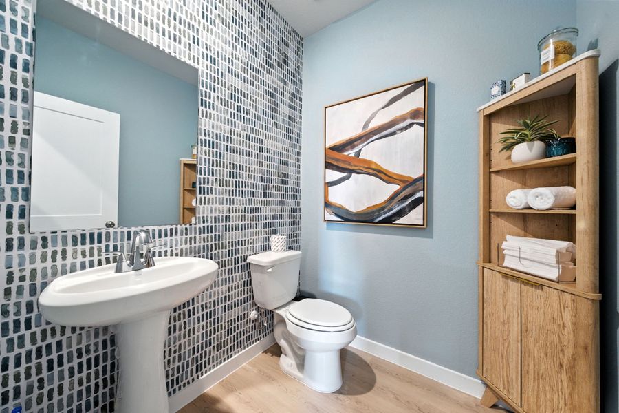 A bathroom with a sink and a toilet. A bathroom with a sink and a toilet.