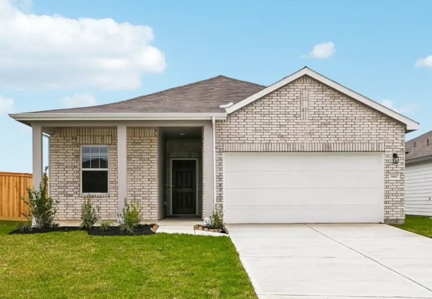 Front exterior of a home in the Sunterra Lakes community, located in Brookshire, TX (Image 4).