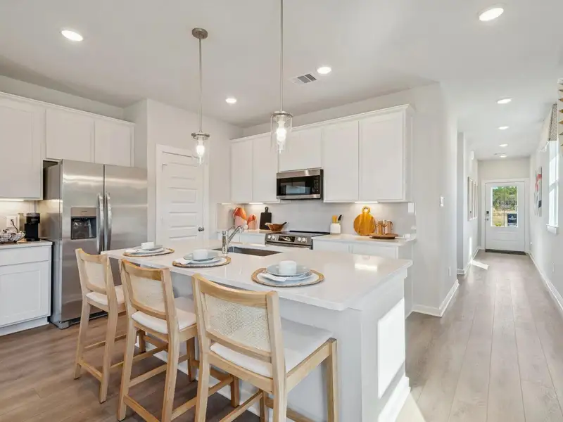 Furnished interior in a model home at Spring Branch Crossing in Conroe (Image 5).