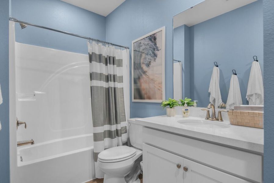 Furnished interior in a model home at Southern Palms in Pace (Image 9).