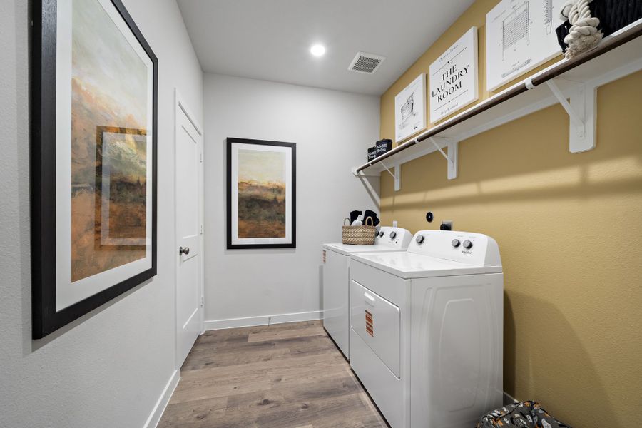 A bathroom with a sink and a washer.