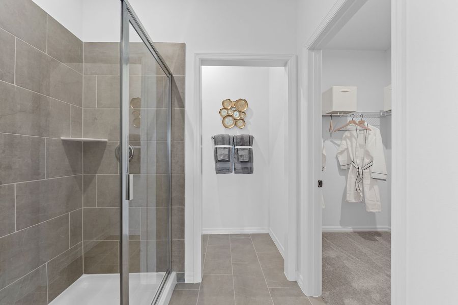 Primary Ensuite Bathroom with Walk-In Closet