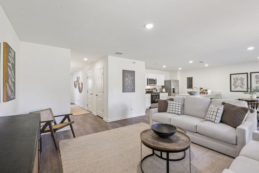 A living room with a couch and a table.