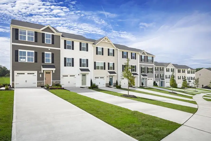 Front exterior of a home in the Rollman Farms Townhomes community, located in Raleigh, NC (Image 3).