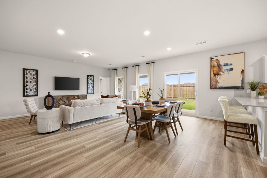 A living room with a wood floor. A living room with a wood floor.