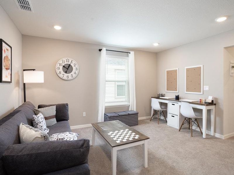 Upstairs, a loft provides desirable flexible-use space - Aria bungalow in St. Cloud, FL