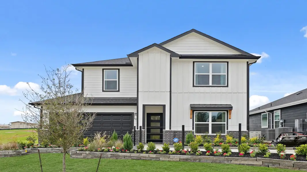 Front exterior of a home in the Chapel Lakes community, located in Montgomery, TX (Image 3).