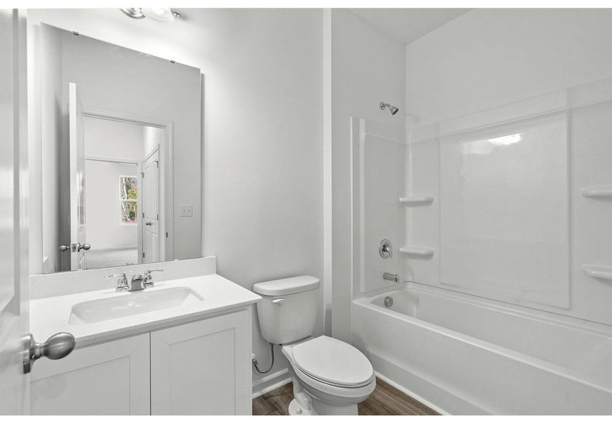 Furnished interior in a model home at Crossing at Givhans in Ridgeville (Image 9). Furnished interior in a model home at Crossing at Givhans in Ridgeville (Image 9).