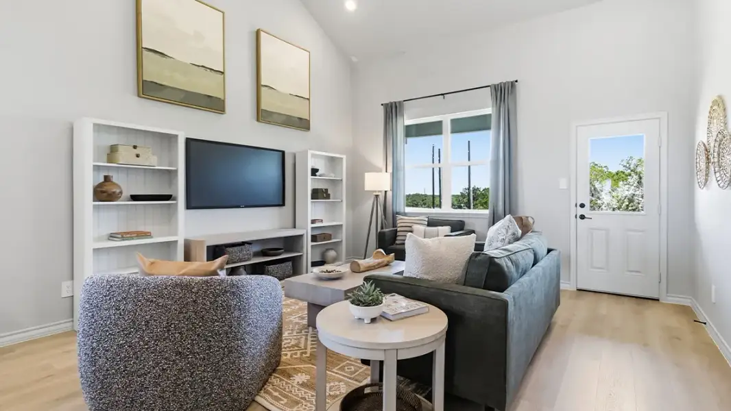 Furnished interior in a model home at The Woodlands at Medina Hills in Mico (Image 32).
