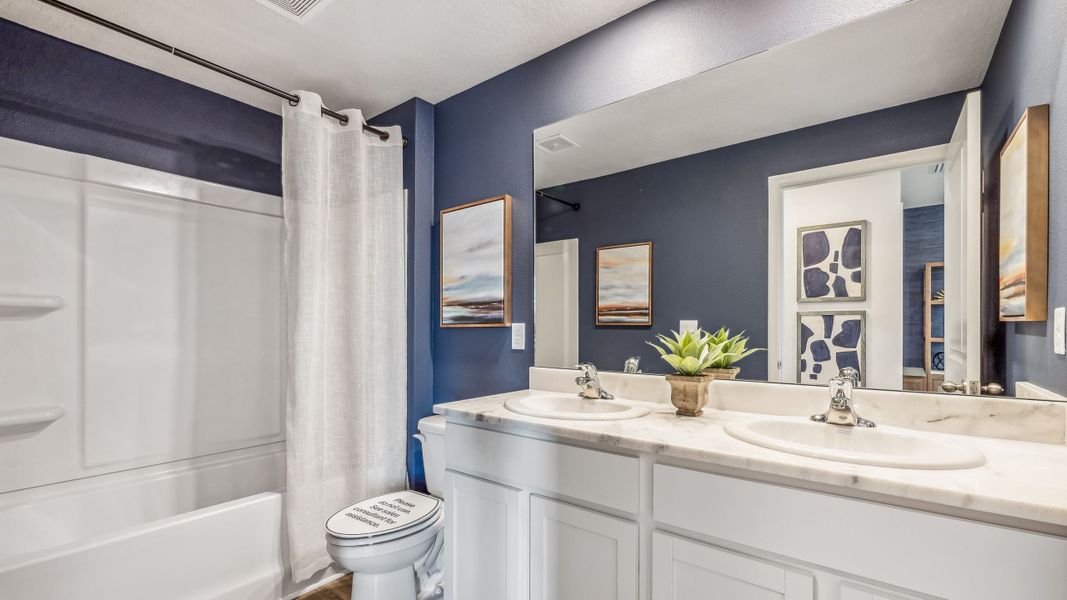 Furnished interior in a model home at Bella Lago in Parrish (Image 26).