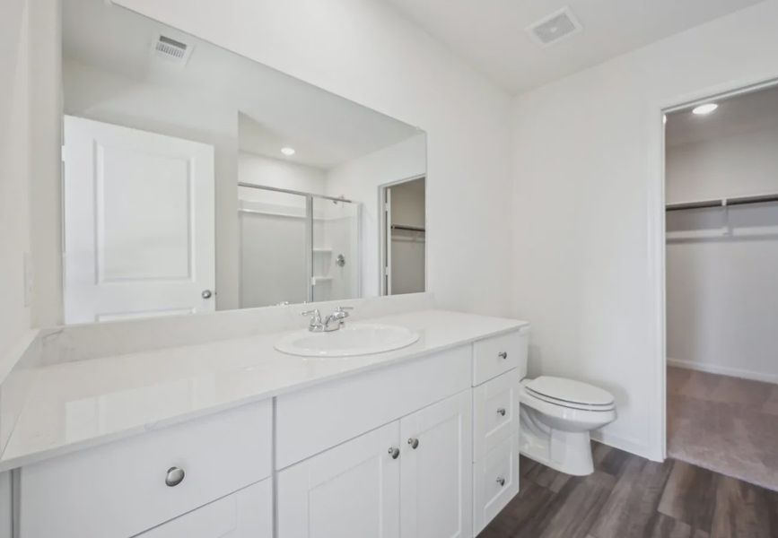 Furnished interior in a model home at Pender Woods at Cane Bay in Summerville (Image 7).