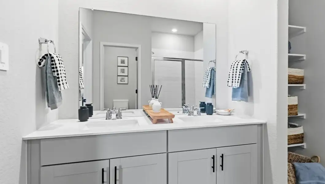 Furnished interior in a model home at The Woodlands at Medina Hills in Mico (Image 7).