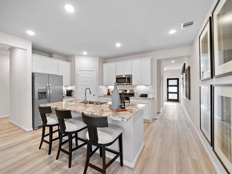 Furnished interior in a model home at Saddle Creek Ranch in Cibolo (Image 10).