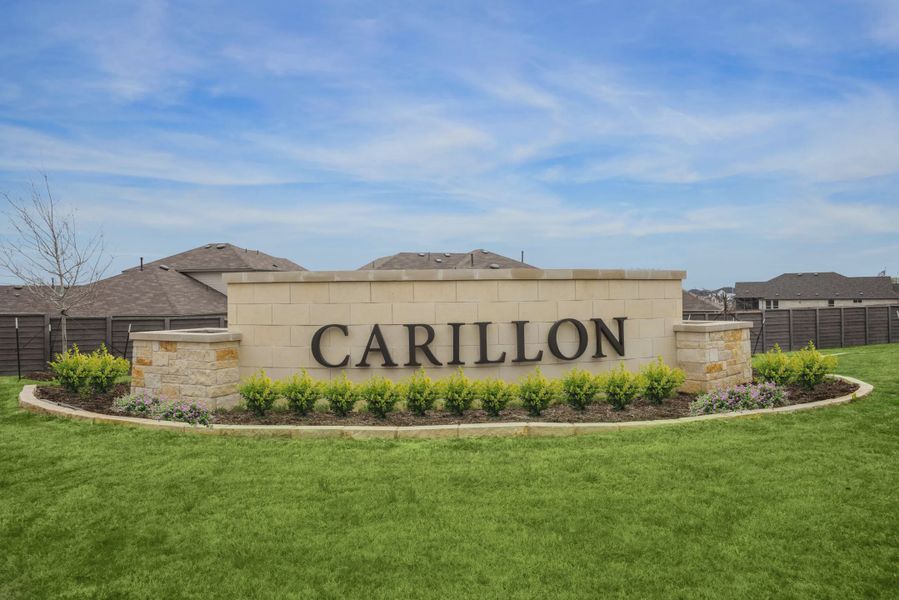 Entrance to the Carillon community in Manor, TX, featuring signage and landscaping (Image 2). Entrance to the Carillon community in Manor, TX, featuring signage and landscaping (Image 2).