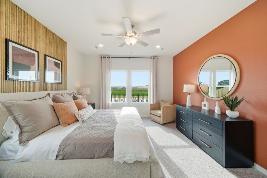 A bedroom with a large mirror. A bedroom with a large mirror.