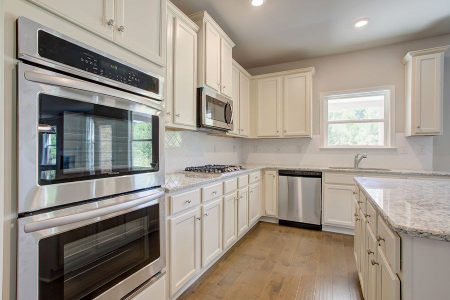 Furnished interior in a model home at Cove Lake Estates in Conley (Image 5).